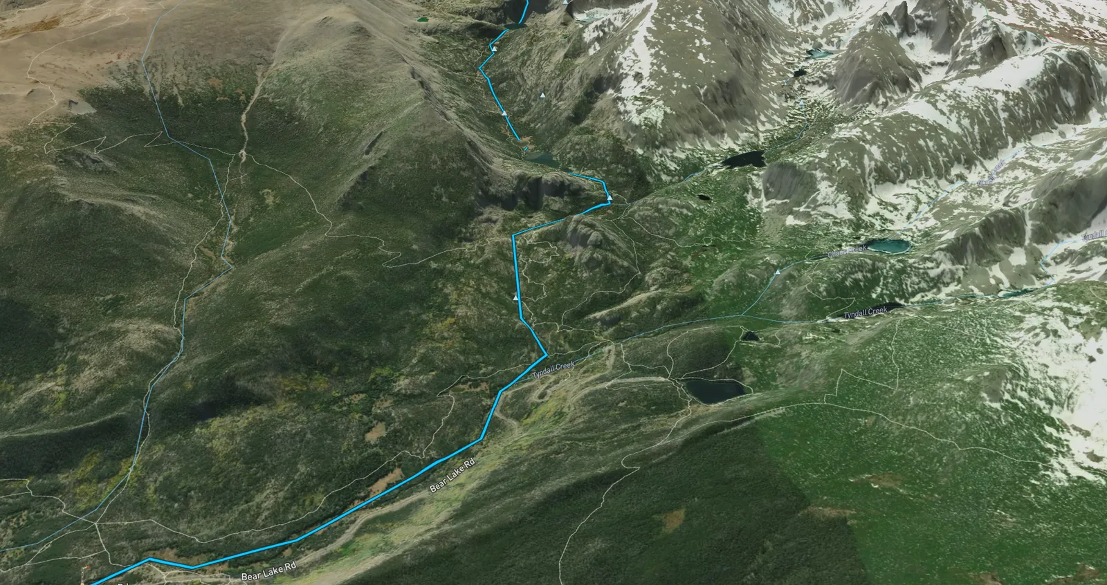 An Atlas view of a high-country watershed, with selected water running beneath mountain ridges and alpine lakes.